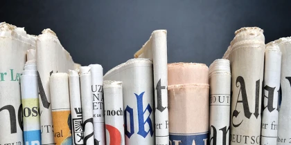 Newspapers lined up in a row